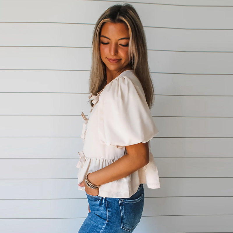 Blouse féminine à nœuds décoratifs